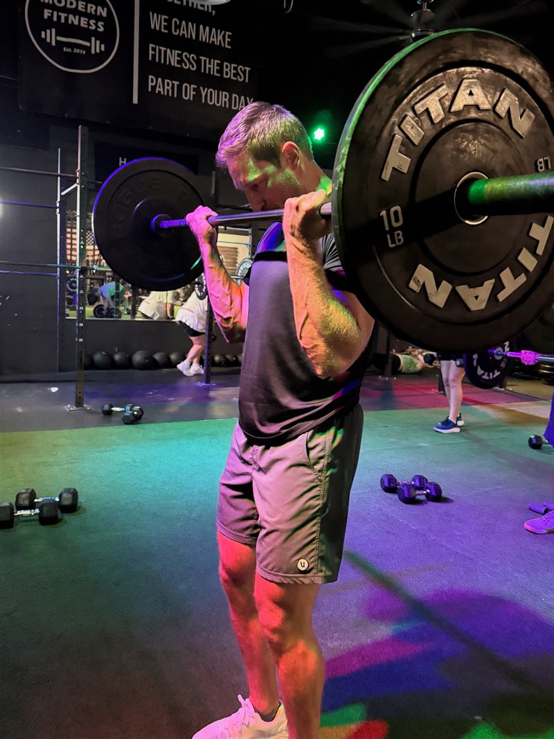 Member doing curls during Flex Friday
