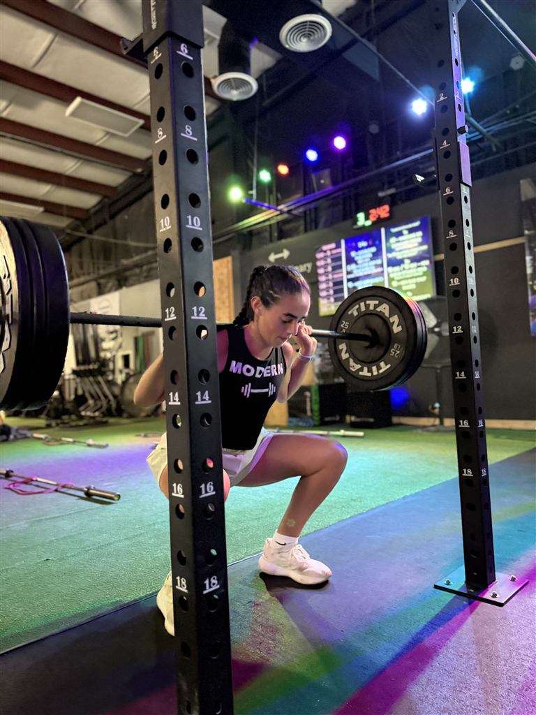 Member squatting at Modern Fitness Tallahassee